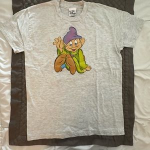 One of Seven Dwarfs on grey cotton ter